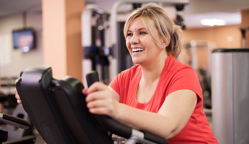 4 Reasons to Keep Going to the Gym During an Outbreak happy woman column width