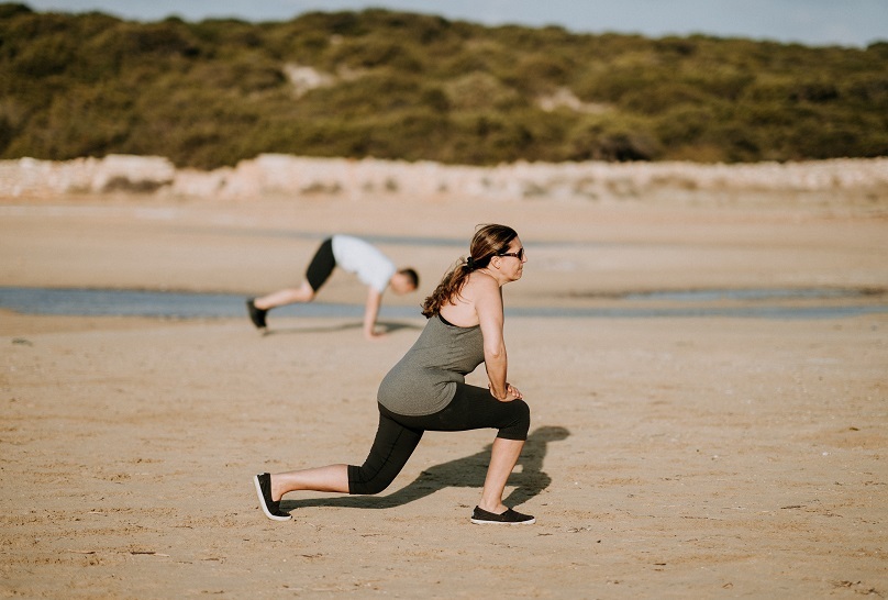 CBI Woman Exercising Beach Unsplash Column