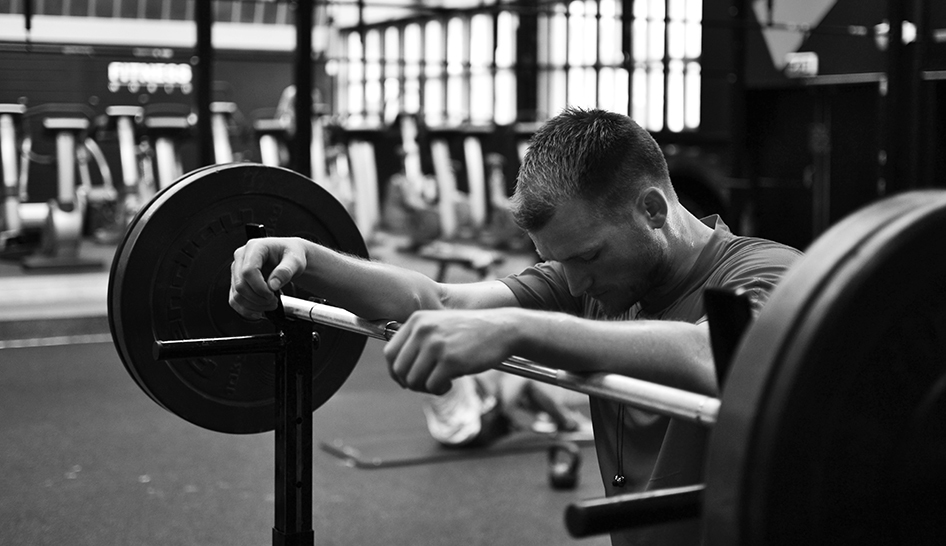 Technology Man Leaning On Barbell Column View