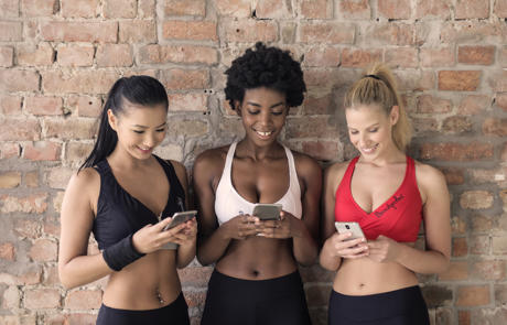 Technology Women In Workout Gear Smartphone Column