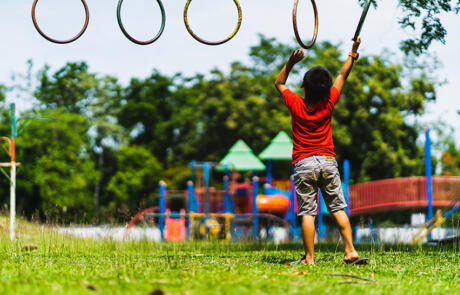 Wellness and community programming child playing playground unsplash stock column