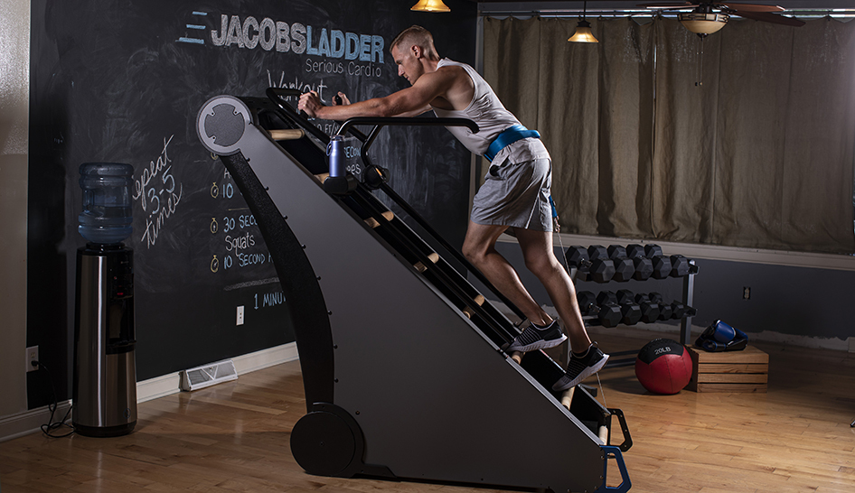 Fitness programming man using jacobs ladder limited use column