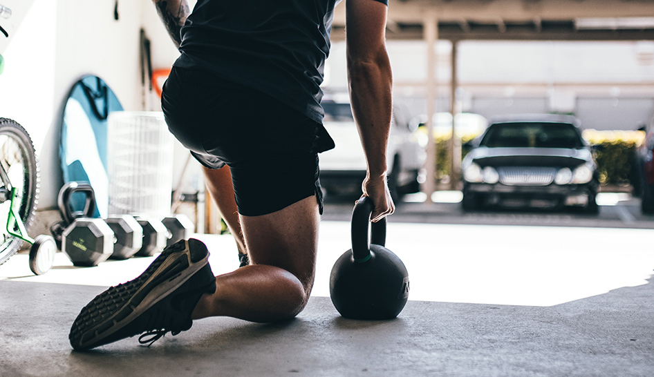 Industry news man outside kettlebell Stock Unsplash column