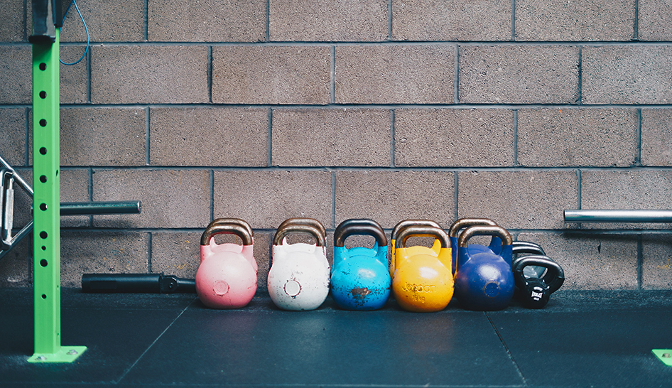 Strategy and finance row of kettlebells Unsplash stock column