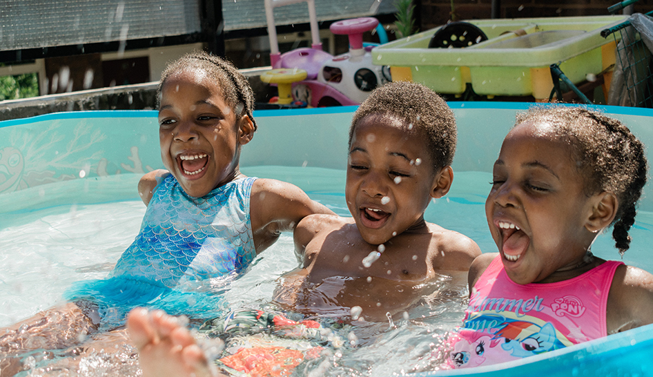 Wellness and community programming children playing in kiddie pool unsplash stock column