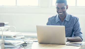 Man desk laptop CBI stock photo listing